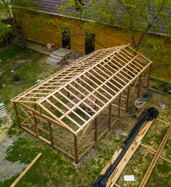 Aerial view of backyard ADU wood framing structure under construction in Los Angeles