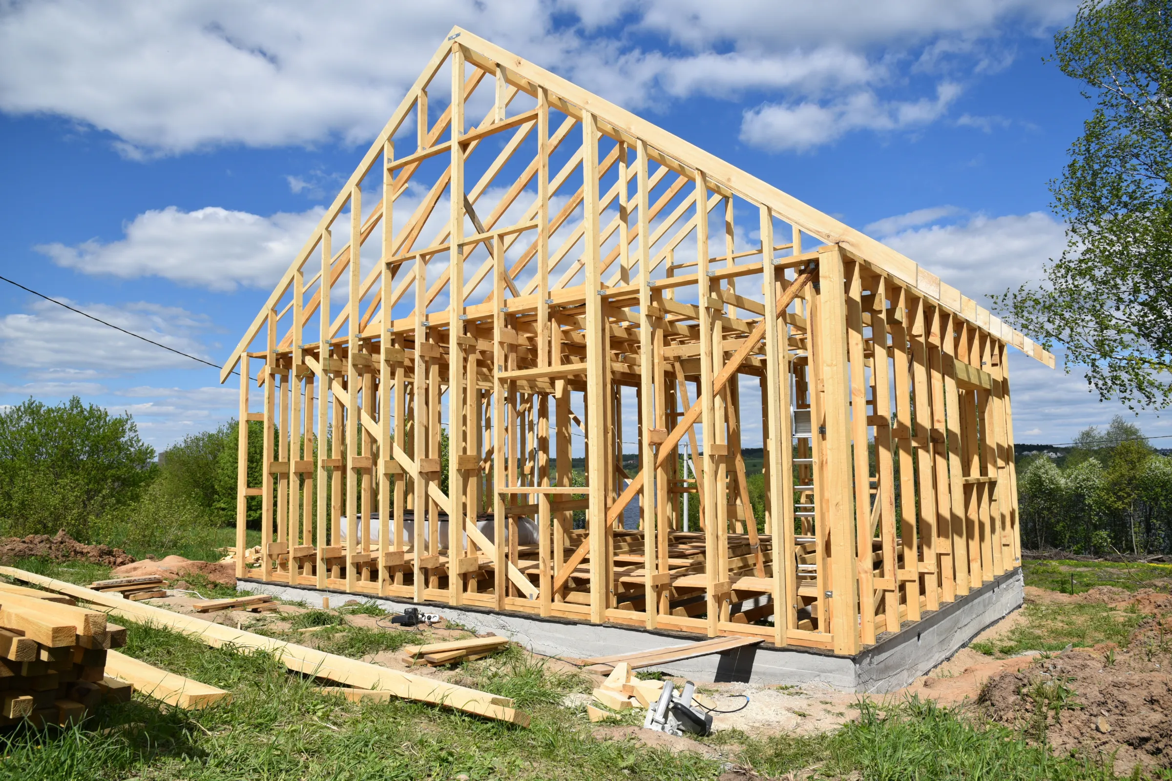 ADU interior buildout in Los Angeles with wood framing construction, roof structure, foundation work, and unfinished exterior shell